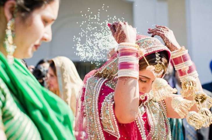 Why Do Newly-Wed Brides Throw Rice During Their Vidaai?